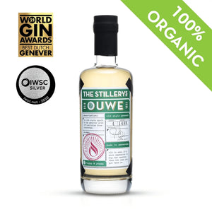 The Stillery's Ouwe Genever: bottle with green label, shown with award logos and a green banner