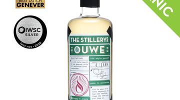 The Stillery's Ouwe Genever: bottle with green label, shown with award logos and a green banner